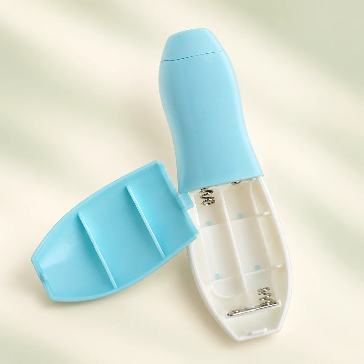 Two AA battery slots in the blue nail file; batteries not included