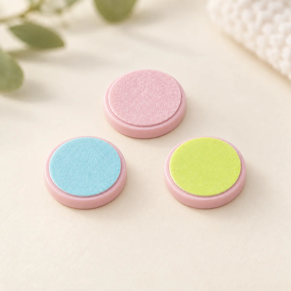 Three replacement filing heads with pink bases; file not included